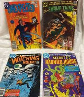 Group shot of all four comic books