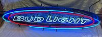 Neon sign lit showing full face with colors