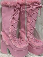 Full side view of both boots showing overall style, heel and platform