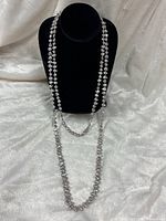 Full length of grey baroque pearl necklace displayed on bust