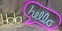 Hola and hello neon signs illuminated