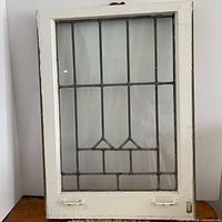 Full view of leaded glass window panel in frame