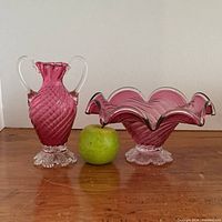 Pitcher and bowl side by side with apple for scale