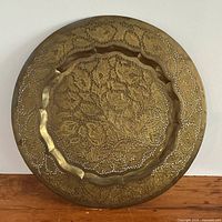 Front view showing full pierced floral design and scalloped center