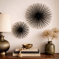 Lifestyle view showing both starbursts on wall above console