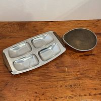Tray and bowl side by side on table