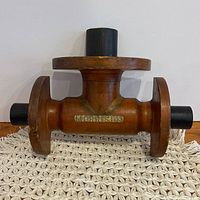 Front view of wooden foundry mold showing full form and core inserts