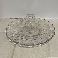 Angled view showing full tray, scalloped edge, and central handle