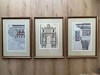 All three framed architectural prints displayed side by side