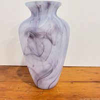 Front view of lavender swirl art glass vase