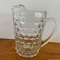 Side view of pitcher showing block pattern, handle and spout