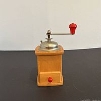 front view showing wooden body, drawer, red knob, overall condition