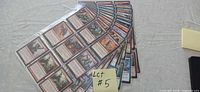 Fan layout of multiple card-filled sleeves labeled Lot #5