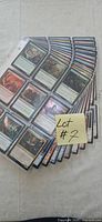 Stack of 10 binder sleeves filled with MTG cards