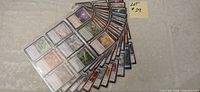 Fanned stack showing multiple binder pages filled with MTG cards in black Eclipse sleeves