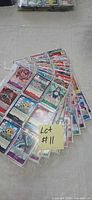 Fanned view of multiple sleeved One Piece trading cards