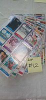 Fan of binder pages showing assorted One Piece trading cards