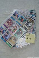 Stack of binder sleeves filled with One Piece cards