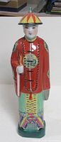 front view of painted ceramic Chinese gentleman figurine
