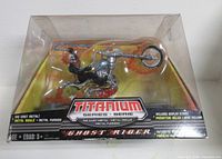 Front of sealed package showing figure and motorcycle