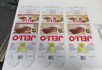 Front view of three Jell-O package flats showing exterior branding