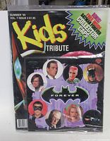 Front of sealed magazine showing Kids Tribute Summer '95 Vol.7 Issue 2 and bonus Batman Forever collector caps pouch