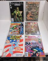 All six bagged comics laid out