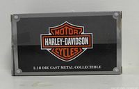 Front of retail box showing Harley-Davidson logo and scale information