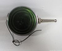 Front view showing green spool face and line