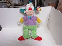 Front view of 16-inch Krusty the Clown plush with tag visible