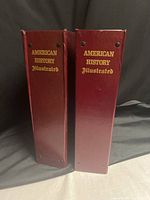 Two maroon binders labeled American History Illustrated