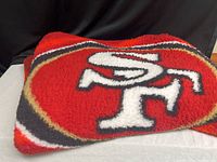 Folded blanket showing large SF logo