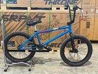 Full left-side view of the BMX bike on stand