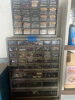 Full view of two stacked organizer cabinets with contents