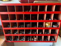 Front view of cabinet cubbies filled with assorted nuts, bolts, screws and washers