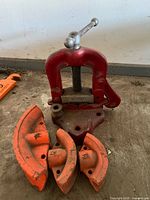 overall lot showing vise and three bender dies