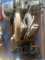 Overhead view of disc sander, circular saw and palm sander