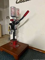 Front view of MEC reloader showing hoppers, handle, ram, mounted base