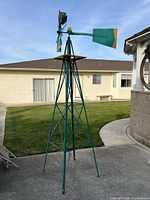 Full view of windmill showing tower and vane