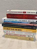 Front view showing stacked spines of nine visible titles