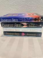 Stack of four Danielle Steel hardcovers showing spines and titles