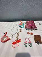 Group shot showing all ten flamingo-themed items laid out