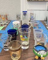 Front view of assorted printed and colored shot glasses
