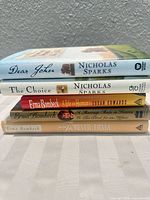 Spine view of all five hardcover books stacked