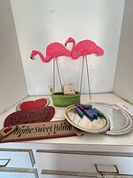 overview of lot showing flamingos, basket, signs, trays, tubes