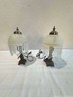 Front view of both lamps showing overall design, bases, shades, cords