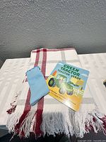 Throw blanket, board book and sock displayed together