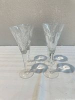 Four Waterford crystal champagne flutes frontal view