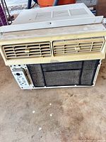 Front view showing vents, filter, control panel