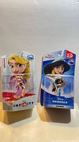 Front view of both sealed Disney Infinity figurines Rapunzel and Jasmine